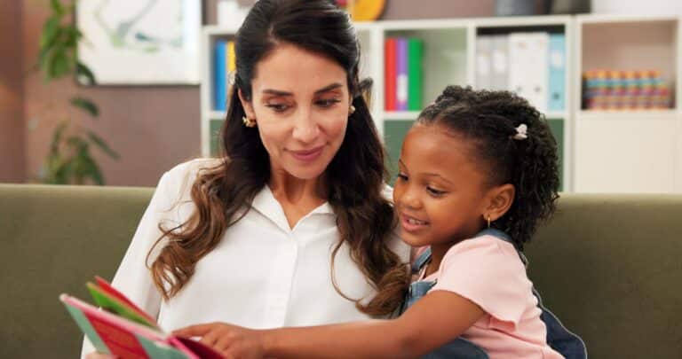 child therapist sitting on a couch with a child