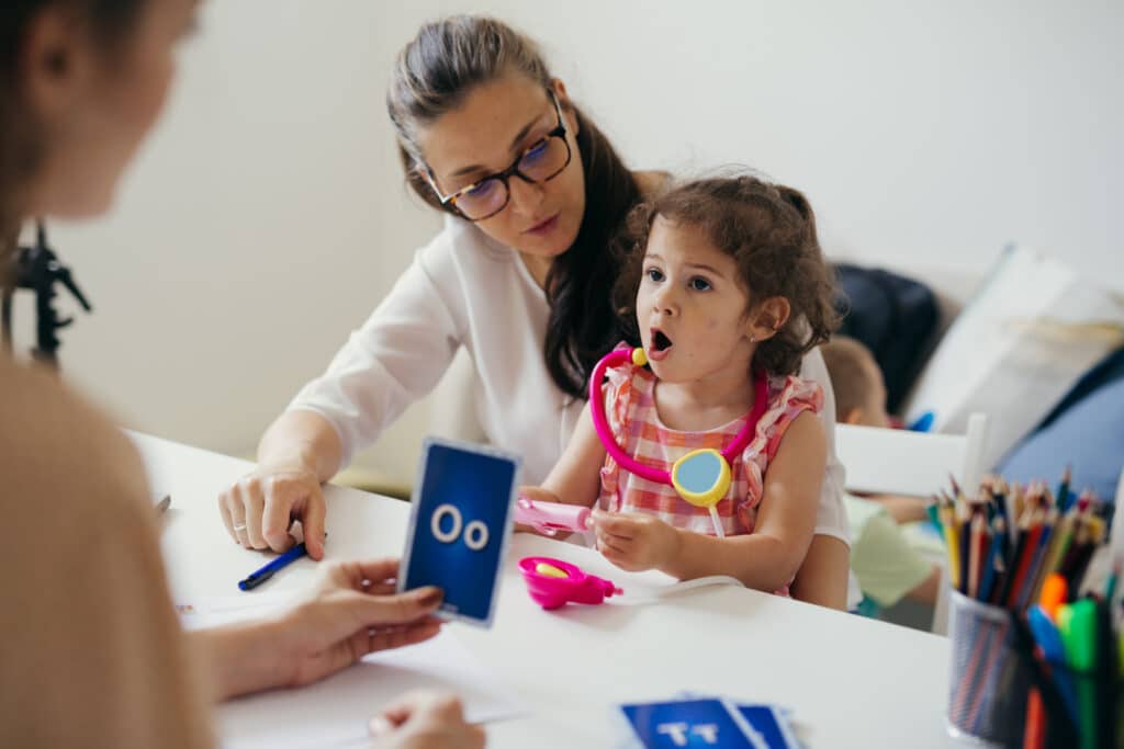 child and therapist practicing speech