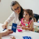 child and therapist practicing speech