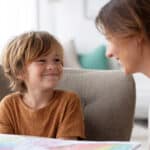 child and therapist looking at eachother