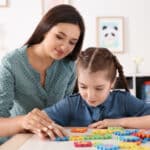 child therapist and child working on a puzzle together